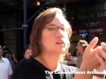 People in street watch Tower Two fall and react