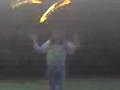 Hippy takeing fire poi poi on head with u f o