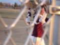 Augsburg College softball Jessa Hinz tries to confuse the umpires