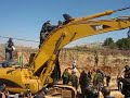 Palestine: Activists climb on Israeli Bulldozers