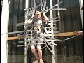 Duct Taping Micah to the wall