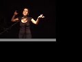 Poet and performer, Corie Feiner, takes the stage with her poem, 