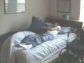 demonstration of undressing from long sitting while in bed