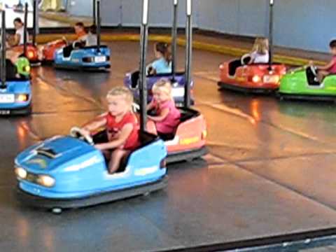 females driving bumper cars