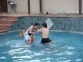 friends fighting in the pool