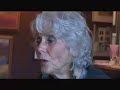 randy olsen chats with elaine madsen, mother of michael & virginia madsen about her poem 'a tiny bit  of me.'  elaine reads the poem and shows us a painting that was inspired from a reading of this poem.
