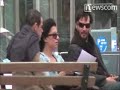 new york, new york - tuesday may 11, 2010. keanu reeves smokes a cigarette while waving and making hand gestures to fans as he sits on a park bench with a couple of friends. the actor, who spurred rumors of a... www.newscom.com