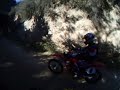 CR 250 on main road Holister hills, NEW TIRE Hooked up and he looped it. Caught on camera with GoPro helmet cam.