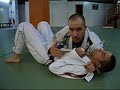 Choke with the gi from knee on the stomach