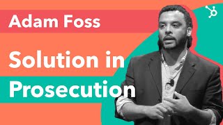 Photo of Adam Foss speaking