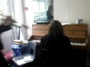 Josie blowing a trumpet in unsuspected Jenny\
