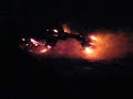 Lava flow into ocean at night