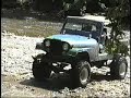 Jeep wheelie while climbing creek bank Jeep wheelie while climbing creek bank