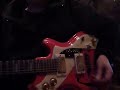 KLOOT PER W plays bottleneck guitar with a small medicin jar.
