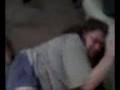 Small man wrestles large woman