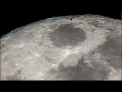 UFO Space Craft Flying Across the Full Moon Surface 