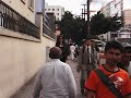 It is me walking in the streets of Sao Paulo, Brazil.I am really huge! Everybody is tiny compared to me(I am 6' 8
