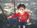 Zoe almost falls out of the swing.AVI