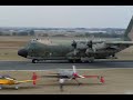 C-130 Hercules flyby, airdrop, landing, recover and takeoff