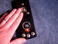 built for nick speak's 40th birthday. the micro casket's sounds come from 3 circuit bent musical birthday cards. the first card plays the e.t. theme, the second plays super freak, the third plays macho man. each circuit is identical, and declocked. touching the metal contacts with the center metal contact affects speed and pitch of each song. audio controls a red led under the red jewel lens. the gear controls volume when using 1/4