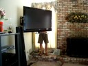 My husband removing base from new tv