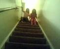 megan and emilee sliding down the stairs
