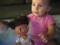 Ellie claps and shows off Dora\