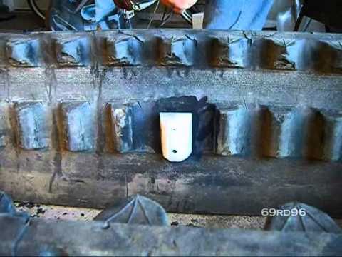 intallation - Installation of Larry Lugs from Bair Products on a rubber track from a Cat 247B2 MTL skid steer.