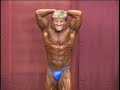 NPC bodybuilder Stacy Seals posing backstage