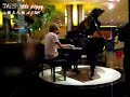 070821 - TaeHwa playing the piano in China