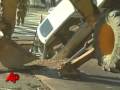 Raw Video: Car Stuck in Washington Street Hole