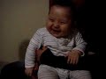 Lauging baby with a baloon