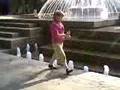 Girl picking coins at the fountain