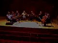 ...in rehearsal for a performance in new york city october 11th, 2007

kenneth sillito violin and leader
harvey de souza violin
paul ezergailis violin
martin burgess violin
robert smissen viola
duncan ferguson viola
stephen orton cello
john heley cello

the academy of st. martin in the fields was formed in 1959 by a group of eleven enthusiastic musicians with the aim of performing in public without a conductor. their first three recordings led to a succession of long-term contracts, and the academy quickly took their place among the most recorded ensembles in history. as the repertoire expanded from baroque to mozart, bartok and beethoven, so it became necessary for the principal violin, neville marriner, to conduct the larger orchestra.

the academy of st. martin in the fields chamber ensemble was created in 1967 to perform the larger chamber works?from quintets to octets?with players who customarily work together, instead of the usual string quartet with additional guests. drawn from the principal players of the orchestra, the chamber ensemble tours as a string octet, string sextet, and in other configurations including winds. its touring commitments are extensive, with annual visits to france, germany, and spain, and frequent tours to north and south america, australia, new zealand, and taiwan.

the ensemble's fall 2007 north american tour brings them to 10 cities, including (among others) new york, chicago, los alamos, and cedar falls, ia.

contracts with philips classics, hyperion, and chandos have led to the release of over thirty cds by the chamber ensemble.