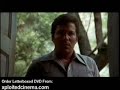 In Kingdom of the Spiders a swarm of huge tarantulas, enraged by the misuse of pesticides, try to take over their part of the world. Dr. Robert Hansen (William Shatner), a local Arizona veterinarian joins forces with entomologist Diane Ashley (Tiffany Bolling) to keep the spider population under control. Woody Strode and Altovise Davis also appear as the owners of a neighboring ranch. ... Kingdom of the Spiders William Shatner Drive-in horror movie film genre trailer 