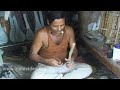 Kolkata (Calcutta), West Bengal state of India is famous for the production of Ektal, a musical instrument widely used by the street singers in the city. This video shows the making of Ektal by a man in his shop selling musical instruments.