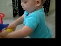 Owen using push toy to walk 18 mo (spina bifida)