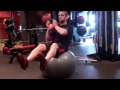 KettleBell Carry on Swiss Ball - While balancing on a swiss ball, move a kettle bell from shoulder to shoulder. Be sure to focus on keeping your abs tight and back as straight as possible.