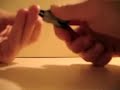 A Craftorial about how to make teeny little paper hangers out of paperclips
