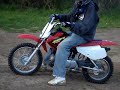 Me and friend riding Honda 70 and KTM 125