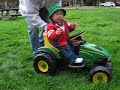 Chenchen 7 months: driving a John Deere tractor