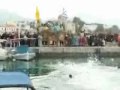 Diving for the Cross on Epiphany Day, Aegina Island, Hellas: 2008. In the video is the Metropolitan Bishop of Hydra, Spetsae and Aegina, Ephraim, reading the Gospel of Christ's baptism and then throwing the Cross into the water. Five young men dive for the blessing to retrieve the Cross.