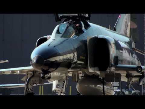 fighter jet f 4 - F4 Phantom starting engines and taxiing out for take off in Cleveland, Ohio during the 2011 Cleveland Air Show. The plane was on the ramp with the Thunderbir...