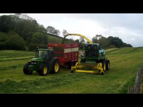  6920, 6910s 6910 and a massey 5470 with herron silage trailers