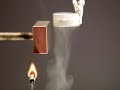 In a candle cup is liquid nitrogen, beside it a stron neodym magnet. On the cup condensates Oxygen, the drops are attracted by a strong magnet. The flashing flame shows, that the drops are Oxygen, the attraction shows the paramagnetic behaviour. The boiling temperature of Oxygen is about 90 K - a bit higher than liquid Nitrogen (77 K). So Oxygen condensates more than Nitrogen. A video by Eduard Schittelkopf