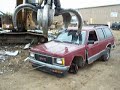 Demolishishing & Crushing 92 Chevy Blazer with an excavator