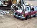 Demolishishing & Crushing 92 Chevy Blazer with an excavator