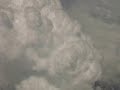 Flying around a storm at 40,000ft [Amazing Dogface visible at 52 seconds!]