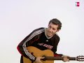 Rudy Fernandez on acoustic guitar
