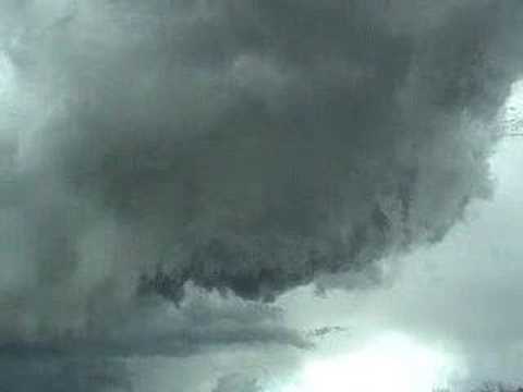 Rapidly rotating wall cloud east of ...